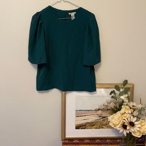 Green top with fun sleeves